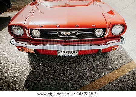 MALAGA, SPAIN - JULY 30, 2016: 1966 Ford Mustang front view in red color, parked in Malaga, Spain.