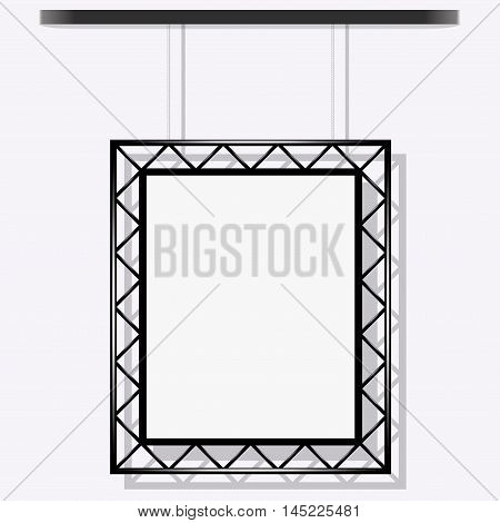 black frame on a rope on a gray wall.