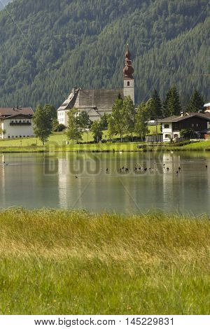 Lake Pillersee With Parisch Church In Sankt Ulrich Am Pillersee