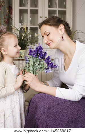 young mother with daughter at luxury home interior vintage, old fashion relashionship family