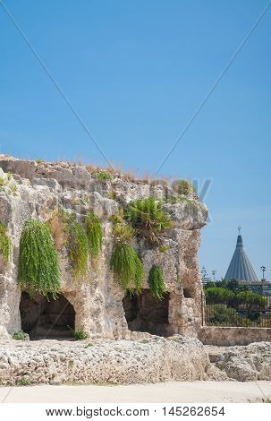 Section of the upper part of the greek theater in Syracuse with its typical rock cut tombs