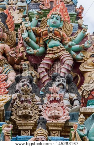 Madurai India - October 19 2013: Closeup of image representing the fierce goddess Kali also known as Durga. Facade of South Gopuram at Meenakshi Temple.