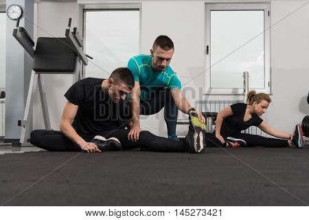 Gym People Stretching And Looking Very Happy