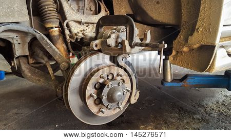 Old disk brake repair in the garage, mini-truck