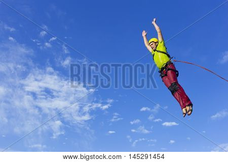 The first jump off the cliff with a safety rope.