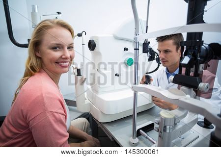 Portrait of female patient smiling in ophthalmology clinic