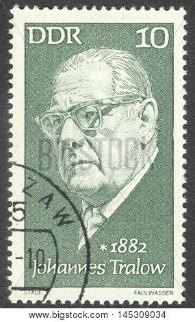 MOSCOW RUSSIA - CIRCA AUGUST 2016: a stamp printed in DDR shows a portrait of Johannes Tralow the series "Famous Persons" circa 1972