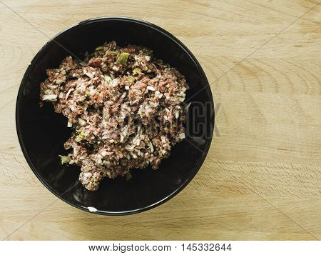 Mixing Steak Tartare Ingredients In A Bowl
