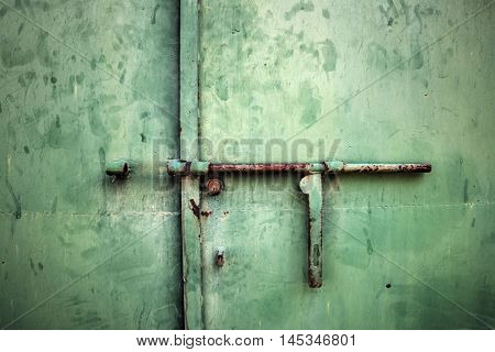 close up of a rusty metal deadbolt