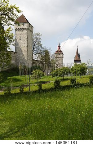 LUCERNE SWITZERLAND - MAY 04 2016: Towers of Lucerne's ancient city walls. These historic fortifications are called Musseg and are mostly very well preserved