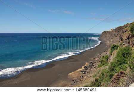 Fishing Boats Under Cliff