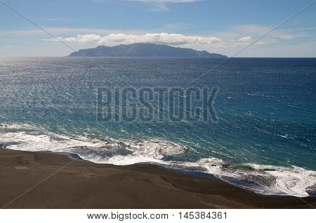 Waves Smash Beach As Brava Sits At Sea