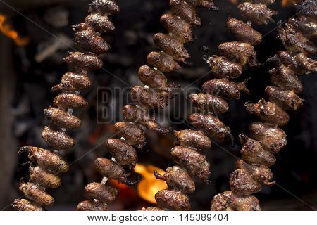 Churrasco, Traditional Brazilian Barbecue, Chicken Hearts Grilled Kebabs.