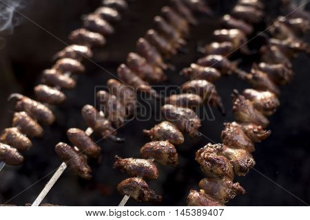 Churrasco, Traditional Brazilian Barbecue, Chicken Hearts Grilled Kebabs.