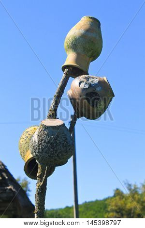 Traditional ukrainian clay pots on the wicker fence