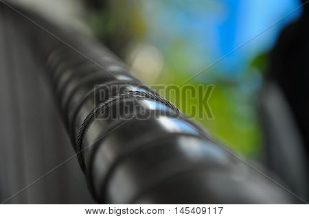 Metal wire or steel rope, wrap around a stainless steel rail