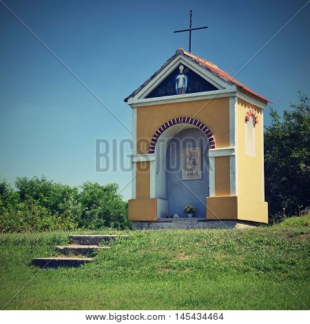 Beautiful little chapel. Europe - Czech Republic. South-Moravian region. Beautiful landscape with sunset - wine region.