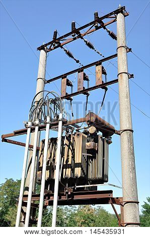 old voltage transformer on a concrete pole