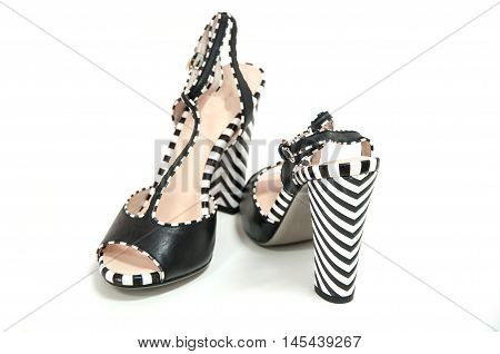 Pair Of Female High Heeled Slingbacks With Striped Heels On White Background.