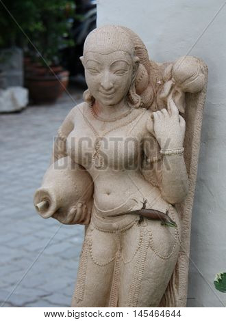 A Small Lizard Sits On The Hip Buddhist Statues