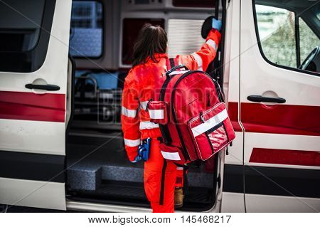operator with emergency rucksack in an ambulance