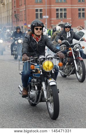 STOCKHOLM SWEDEN - SEPT 03 2016: Closeup of old fashioned motorcycles and bikers at the Mods vs Rockers event at the St:Eriks bridge Stockholm Sweden September 02 2016