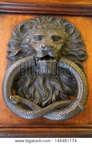 Old and ancient knocker in the city of Rome