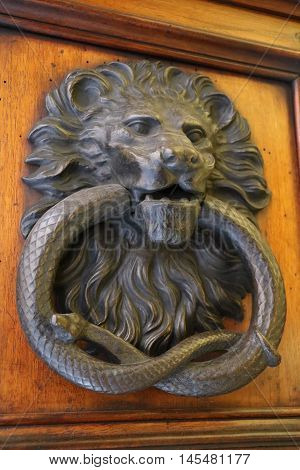 Old and ancient knocker in the city of Rome