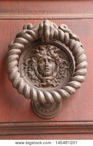 Old and ancient knocker in the city of Rome