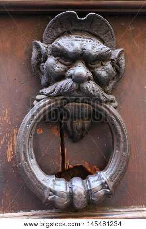 Old and ancient knocker in the city of Rome