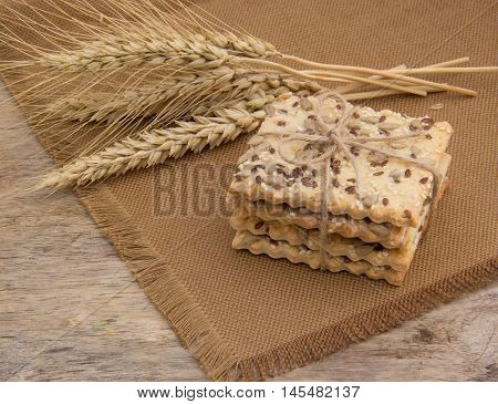Healthy cereal cookies. Ears of wheat. Black sesame seeds