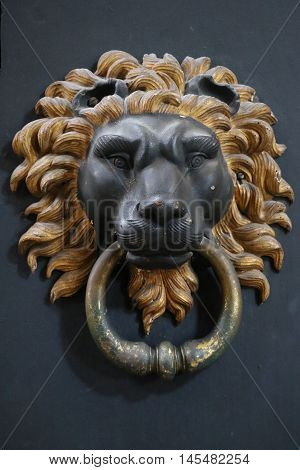Old and ancient knocker in the city of Rome