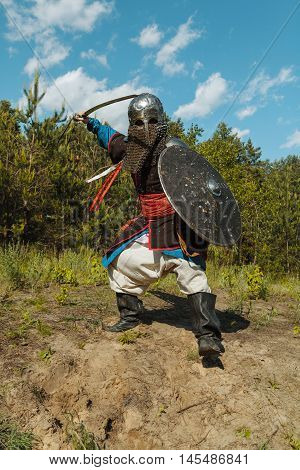 Mongol horde warrior in armour holding traditional saber