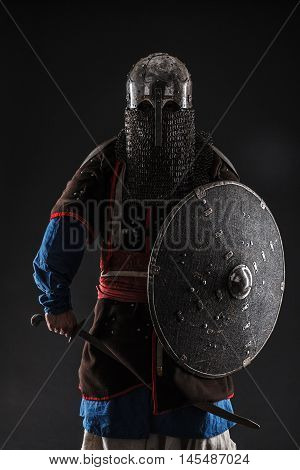 Mongol horde warrior in armour holding traditional saber