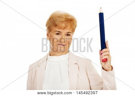 Smile elderly woman pointing up with hege pen