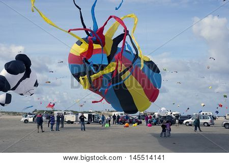 LAKOLK DENMARK - SEPTEMBER 3 2016: Colorful kites on the big beach on Lakolk Romo. International Kite Festival for the 27th time. September 3 2016.