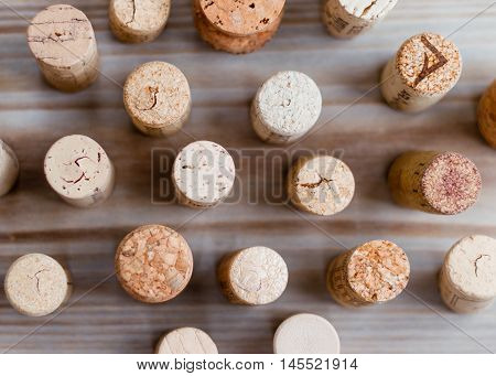 Top view of the wine corks on the wooden table