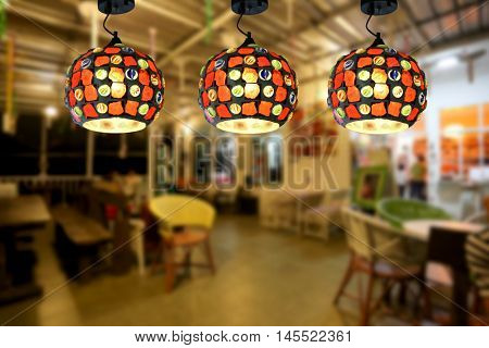 Warm lighting modern ceiling lamps in the cafe and interior decoration restaurant.