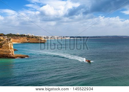 Algarve coast near Armacao de Pera Portugal. Speed boat excursion