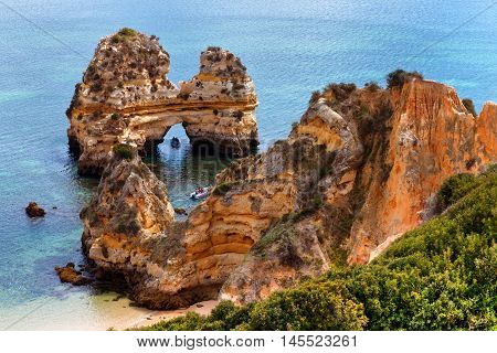 Arch of cliffs on Praia do Camilo beach Algarve Portugal