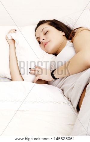A young adult Woman sleeping on the Bed.