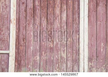 Background of wooden red old fence texture