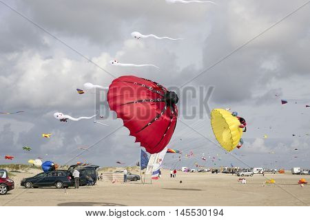 LAKOLK DENMARK - SEPTEMBER 3 2016: Colorful kites on the big beach on Lakolk Romo. International Kite Festival for the 27th time. September 3 2016.