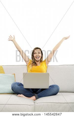 Beautiful woman at home working with her laptop