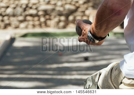 Senior playing petanque fun and relaxing game