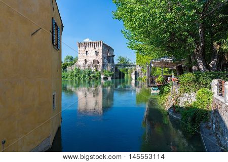 medieval building upon the Mincio river in Borghetto Verona Italy