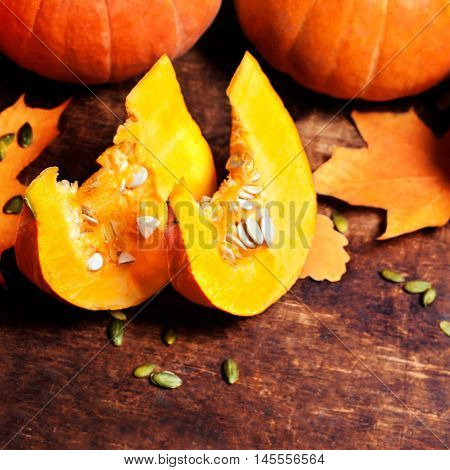 Autumn wood background with pumpkins over wooden table with copyspace. Fall background  poster