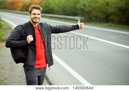 Young Man Hitchhiking