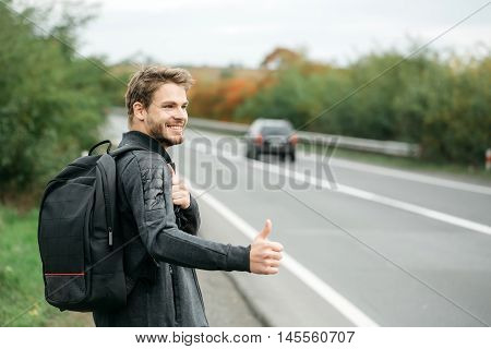 Young Guy Hitchhiking Autostop
