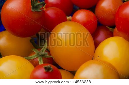 some red and orange small cherry tomatoes